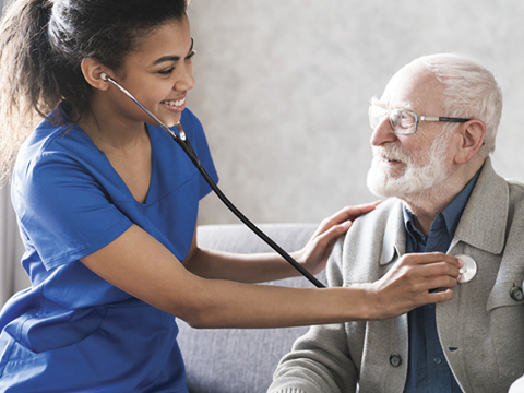 clinician listening to patients heart