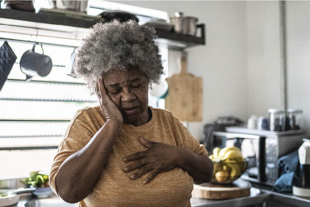Worried Senior Woman In Kitchen