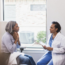 woman holding throat