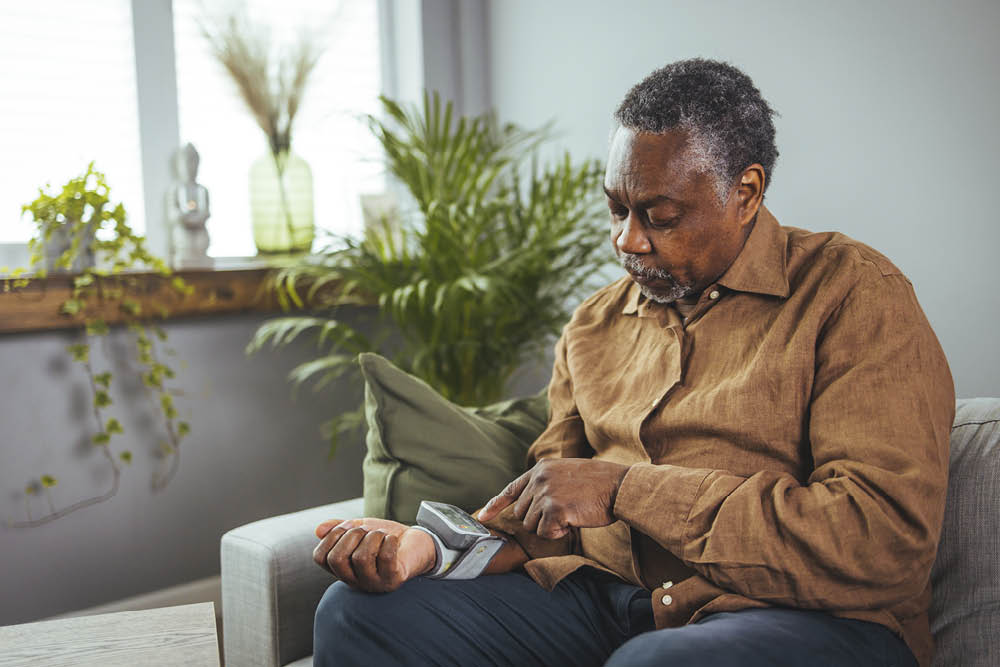 man checking his blood pressure