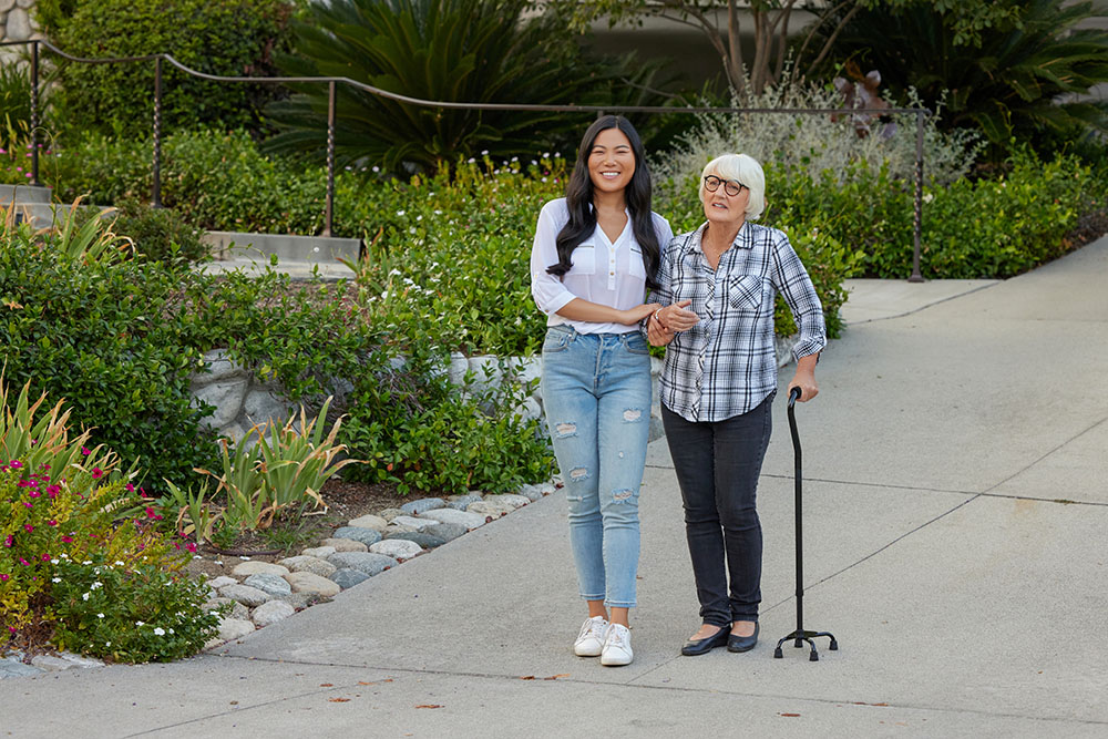 DME FemaleAsianCareTakerWhiteOlderWoman WalkingOutside DriveCane