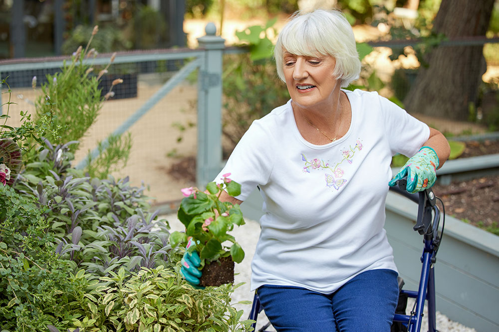 DME WhiteFemale SittingGardeningCloseup DriveRollator2