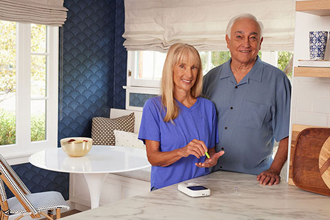 INR WhiteCouple StandingInKitchenTesting RocheINRTestingMonitor