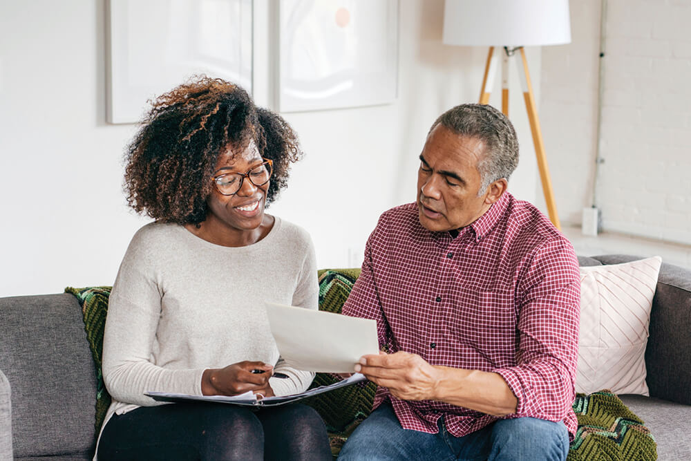 two people reviewing some documents