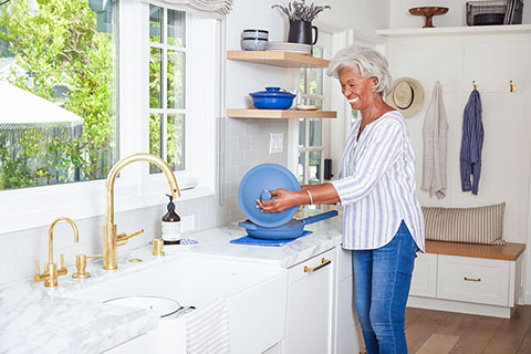 Lifestyle FemaleStandingInKitchenCooking3