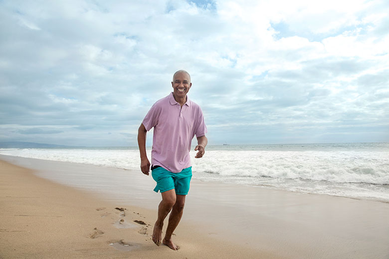 Lifestyle BlackMale BeachRunningandSmiling
