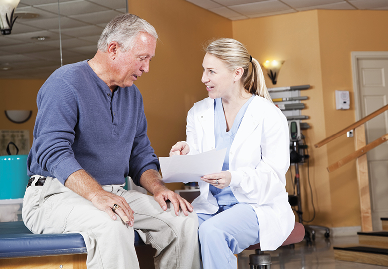 Nurse and patient reviewing paperwork