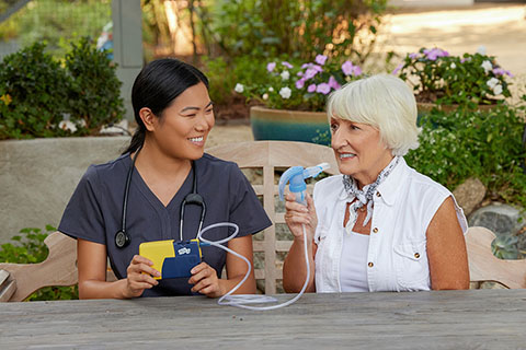 NebulizerAsianClinicianWhiteFemaleSittingOutsidePortableNebulizerPariTrekWithBatteryCharger4745LCS7