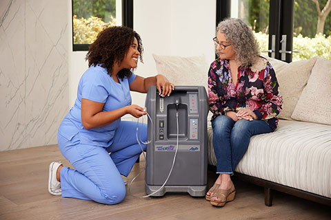 Oxygen BlackFemaleClinicianWhiteFemale SittingOnCouch OxygenConcentrator Airsep 10LPM 3