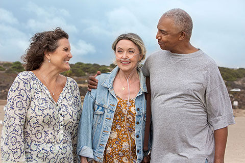 Oxygen WhiteFemalePatient Companion BlackMaleCompanion POC StandingOnBeach ActiveLifestyle