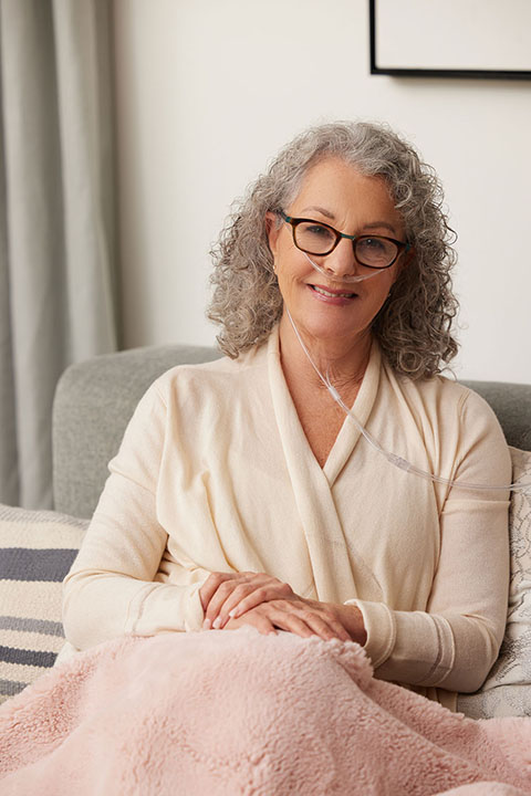 Oxygen WhiteWoman SittingOnCouch NasalCannuala