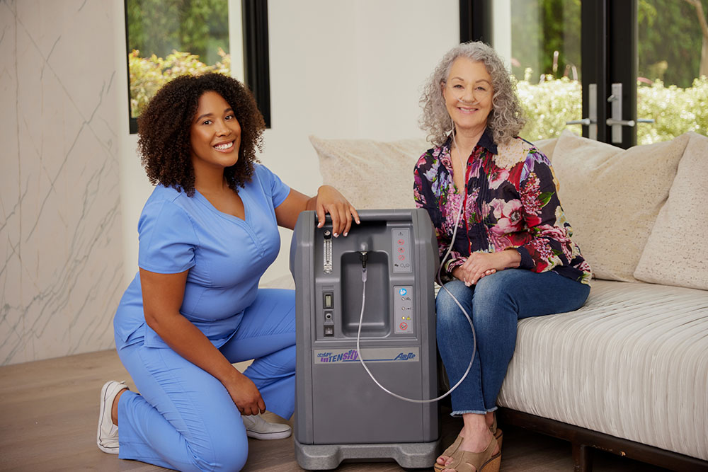 Oxygen Black Female Clinician White Female Sitting on Couch Oxygen Concentrator Airsep 10LPM 4