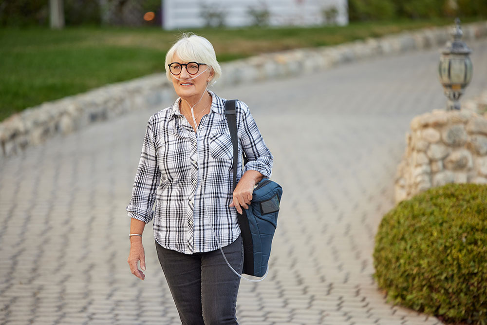 Oxygen Older White Female Patient Portable Tank Walking Outdoors Active Lifestyle 