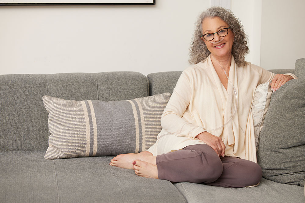 Oxygen White Woman Sitting on Couch Nasal Cannuala