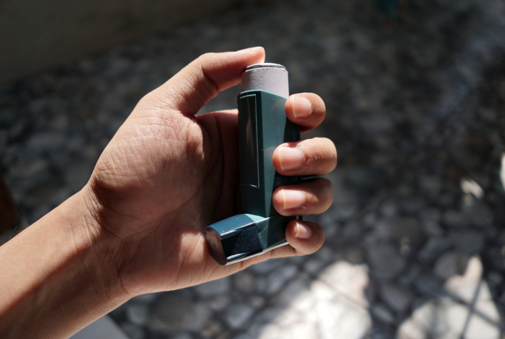 person with inhaler