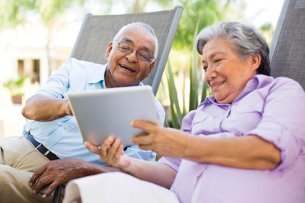 older couple looking at tablet