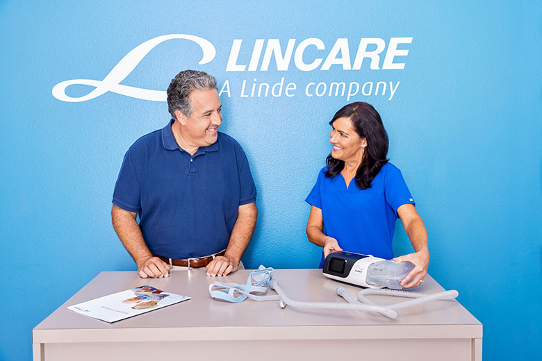 SleepApneaWhiteMalePatientWhiteFemaleClinicianSmilingResMedAirSense11CPAPSetupEducationEpson2FisherA