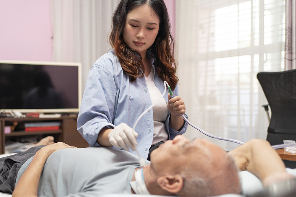 suction therapist working on patient