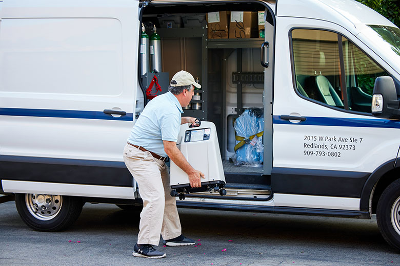 delivery person unloading equipment